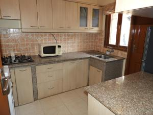 Η κουζίνα ή μικρή κουζίνα στο FF-1 Apartment