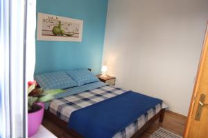 Posteľ alebo postele v izbe v ubytovaní Apartmani Strada