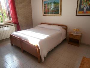 Postel nebo postele na pokoji v ubytování B&B Colle Acquabella