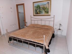 A bed or beds in a room at B&B Colle Acquabella