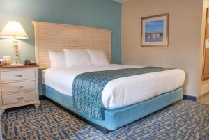 Säng eller sängar i ett rum på Grand Beach Resort Hotel