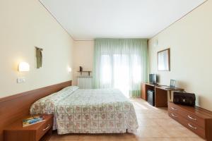 Postel nebo postele na pokoji v ubytování Hotel Fabbrini