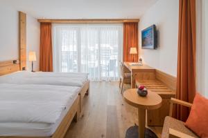 Vuode tai vuoteita majoituspaikassa Hotel Phoenix