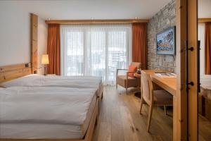 Vuode tai vuoteita majoituspaikassa Hotel Phoenix