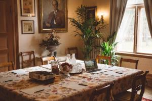 a dining room table with a laptop computer on it at Villa Sjötorp in Ljungskile