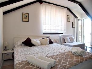 Postel nebo postele na pokoji v ubytování Rooms & Studio Stipcic