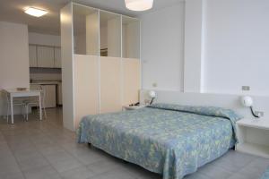 Postel nebo postele na pokoji v ubytování Grand Hotel Golf