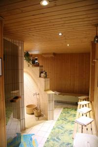 a bathroom with a toilet and chairs in a room at Hotel Alt-Connewitz in Leipzig +45 photos