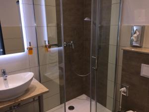 Koupelna v ubytování Median Hotel Garni