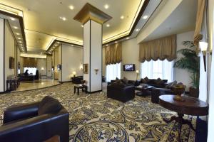a living room with couches and a lobby at Awaliv Hotel in Taif