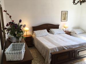 Un pat sau paturi într-o cameră la La Casa di Nila