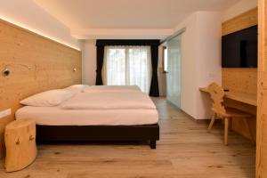 Postel nebo postele na pokoji v ubytování Hotel Silvana
