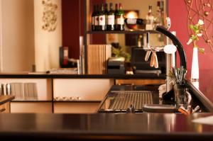 a kitchen with a sink and a counter top at Hotel Dietrichsdorfer Hof in Kiel