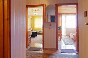 a kitchen and living room with a refrigerator at Violeta 7 Guest House in Nesebar