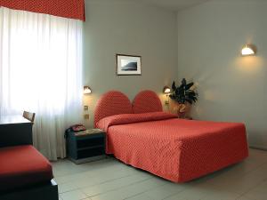 Postel nebo postele na pokoji v ubytování Hotel Palme