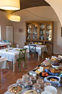 a table with many plates of food on it at Encís d'Empordà -Adults Only- in Casavells