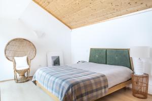 מיטה או מיטות בחדר ב-Cestaria Costa Nova
