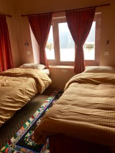 Postelja oz. postelje v sobi nastanitve Hotel Khangri