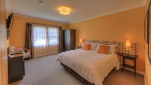 a bedroom with a large bed and a window at Ashdowns of Dover in Dover