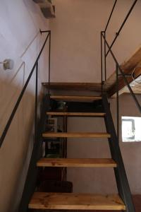 a set of stairs in a tiny house at Casa Acquarossa in Rubiana