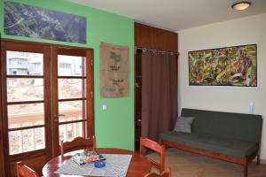 a living room with a couch and a table at Apartamento Fritzi in Ponta do Sol