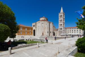 a large building with a tower and a church at Central Boutique Apartments with balconies, in walking distance to the sea in Zadar