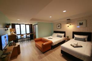 Postel nebo postele na pokoji v ubytování Adagio Bangkok