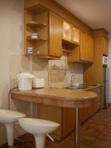 Virtuvė arba virtuvėlė apgyvendinimo įstaigoje Apartments At View Talay