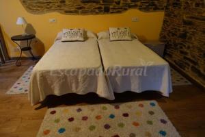 Ein Bett oder Betten in einem Zimmer der Unterkunft Casa Carballeira