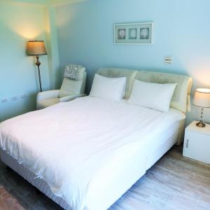 Postel nebo postele na pokoji v ubytování Spring Land Villa & 白舍青丘