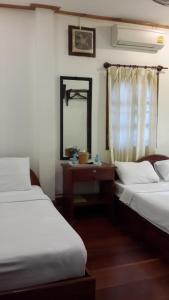 Cama o camas de una habitación en Hoxieng Guesthouse 1