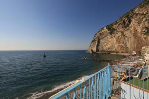 a view of the ocean from a balcony of a beach at terrazza metese in Meta +15 photos