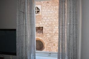 Televízia a/alebo spoločenská miestnosť v ubytovaní Rooms Goga