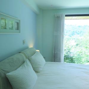 Postel nebo postele na pokoji v ubytování Spring Land Villa & 白舍青丘