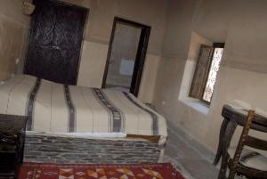 Voodi või voodid majutusasutuse Kasbah Imdoukal toas