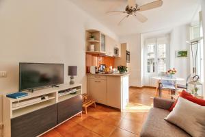 TV a/nebo společenská místnost v ubytování L'Olivette