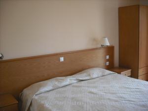 A bed or beds in a room at Summer Memories Aparthotel