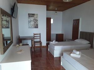 Voodi või voodid majutusasutuse Hotel Riviera toas