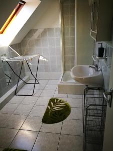 a bathroom with a sink and a toilet and a shower at Kovács Vendégház in Bük +16 photos