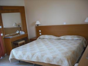 A bed or beds in a room at Summer Memories Aparthotel