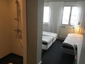 Säng eller sängar i ett rum på Trehörna Hotell & Konferens