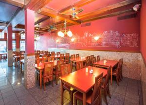 a dining room with wooden tables and chairs at Delta Hotel City Center in Amsterdam