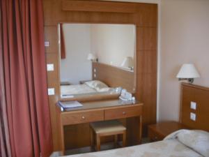 A bed or beds in a room at Summer Memories Aparthotel