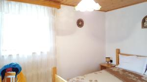 A bed or beds in a room at Ospitalità Diffusa Laste Dolomites - Cèsa Murer