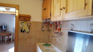 A kitchen or kitchenette at Ospitalità Diffusa Laste Dolomites - Cèsa Murer