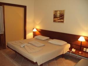 Postel nebo postele na pokoji v ubytování Barlavento Suites
