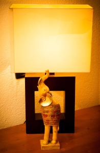 a statue of a woman standing next to a fireplace at Hotel Centrale in Trieste