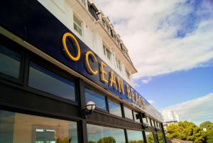 un edificio con un cartel en el costado en Ocean Beach Hotel & Spa - OCEANA COLLECTION en Bournemouth