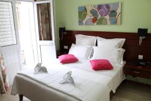 Cama o camas de una habitación en Mindelo Residencial