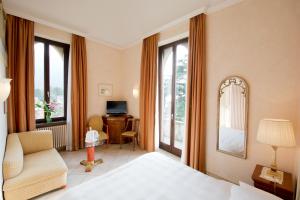 Voodi või voodid majutusasutuse Romantik Hotel Castello Seeschloss toas